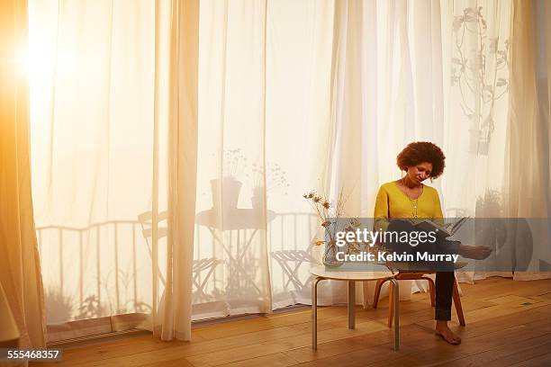 40's couple in apartment - beige curtains stock pictures, royalty-free photos & images