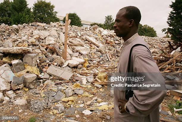 Traore Sekou of Mali, a spokesman for the Parisian African refugees, stands in the ruins of his house on September 15, 2005 in Aubervilliers outside...