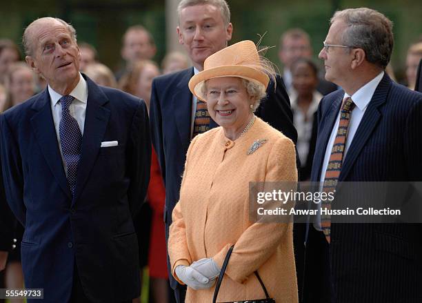 Queen Elizabeth II and Prince Philip, Duke of Edinburgh, stand with the Chairman of the Royal Bank of Scotland, Sir George Mathewson and Fred Goodwin...