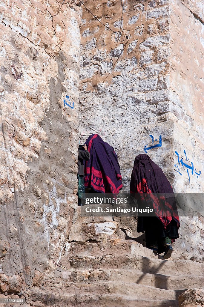 Two women climbing