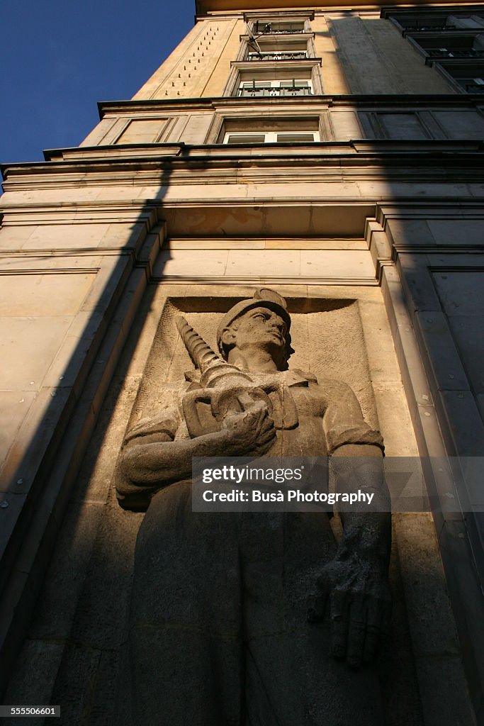 Bas-relief of an industrial worker in Warsaw