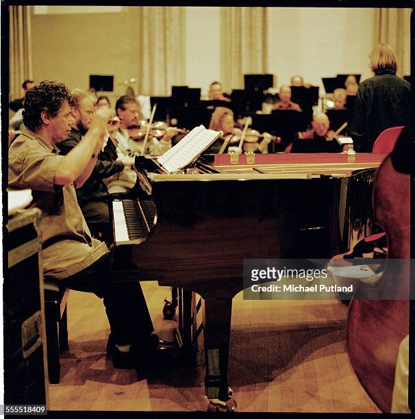 American jazz and fusion pianist Chick Corea rehearses with The London Philharmonic Orchestra for a performance of Mozart's K466 Piano Concerto at...