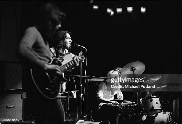 Steve Hackett, Peter Gabriel and Phil Collins of English progressive rock group, Genesis, perform on stage, London, 1971.
