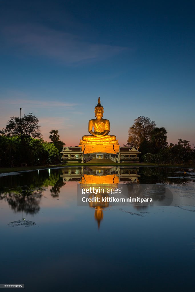 Giant Buddha with reflection during twilight time