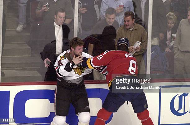 Bob Probert of the Chicago Blackhawks and Peter Worrell of the Florida Panthers exchange punches during the game at United Center in Chicago ,...