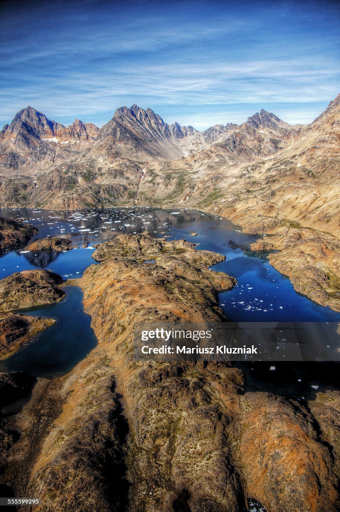 Greenland summer mountains bays floating ice