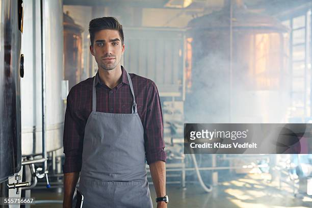 portrait of entrepreneur at microbrewery - distillery stock pictures, royalty-free photos & images