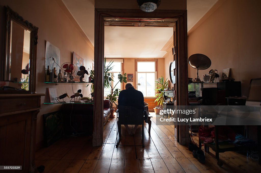 Man sitting in chair at home