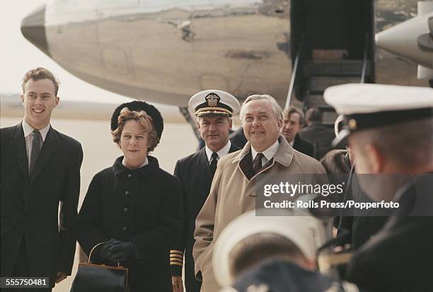 Prime Minister of the United Kingdom, Harold Wilson arrives at an airport in Washington DC with his wife Mary Wilson at the start of a visit to meet...