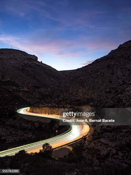 Lights of vehicles in a road in the night