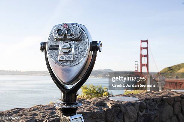 binoculars peering towards the golden gate - coin operated binocular nobody stock pictures, royalty-free photos & images