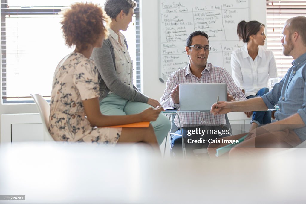 People having meeting in office