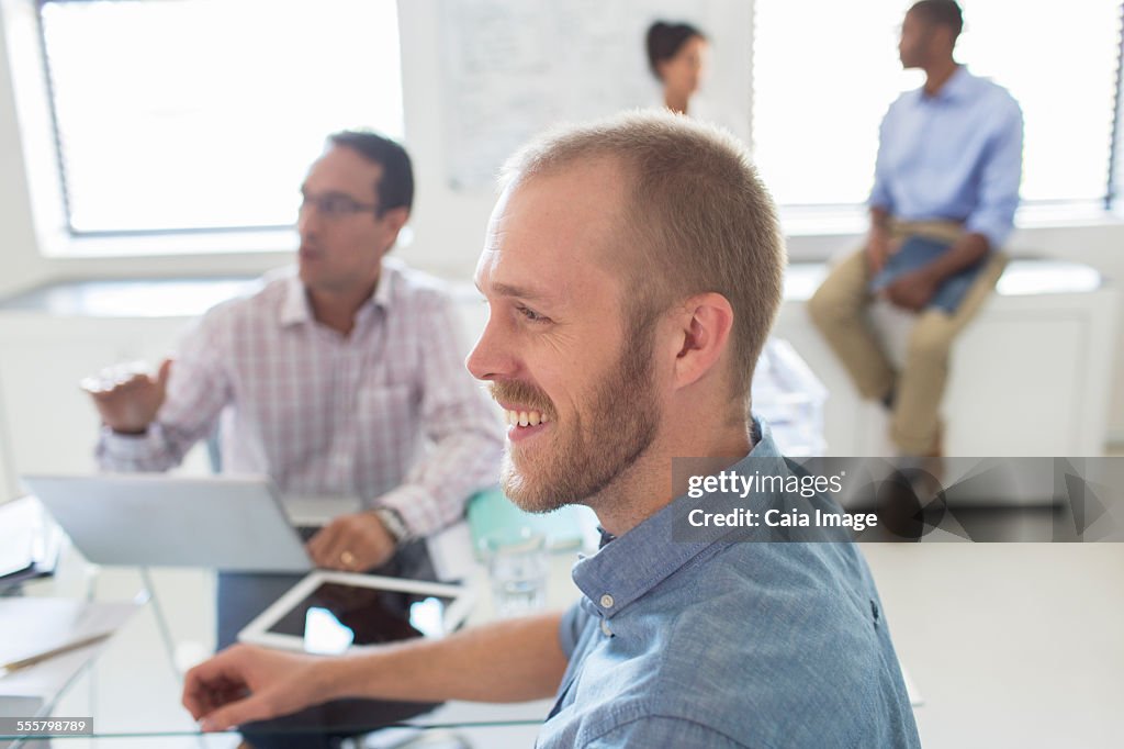 Smiling people during meeting in office