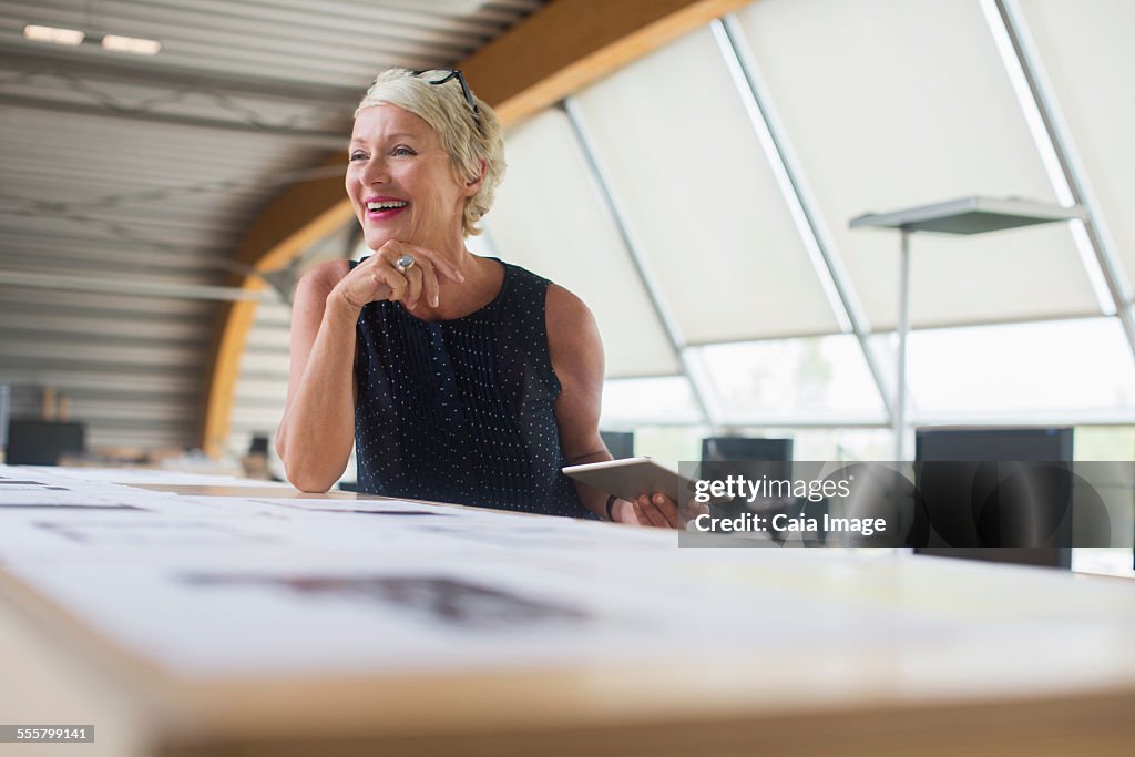 Businesswoman using digital tablet in office