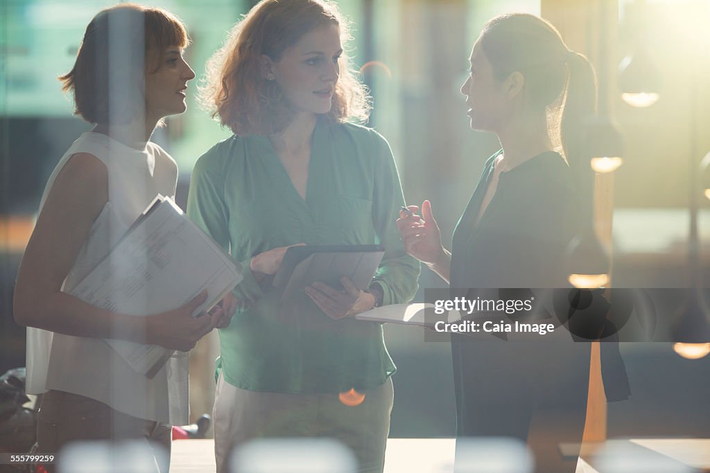 Businesswomen talking in office