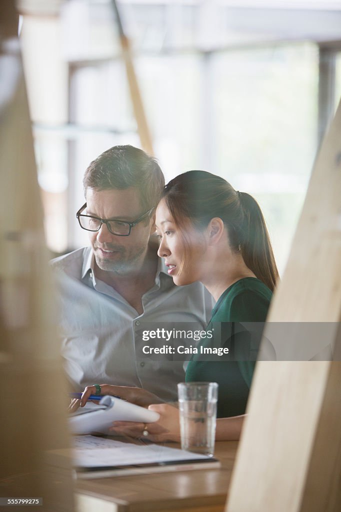 Business people talking at office desk