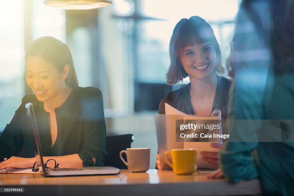 Businesswomen talking in office meeting