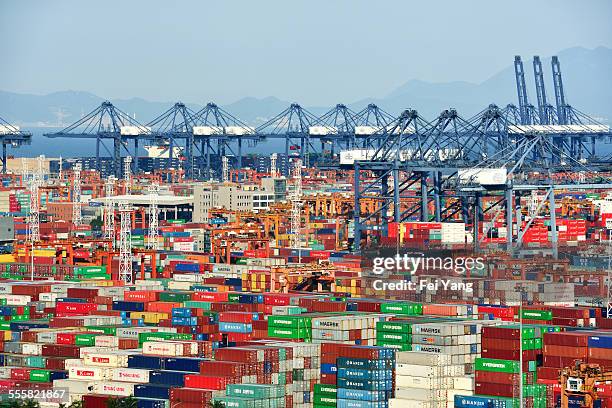 containers and cranes in harbor - china economy stock pictures, royalty-free photos & images