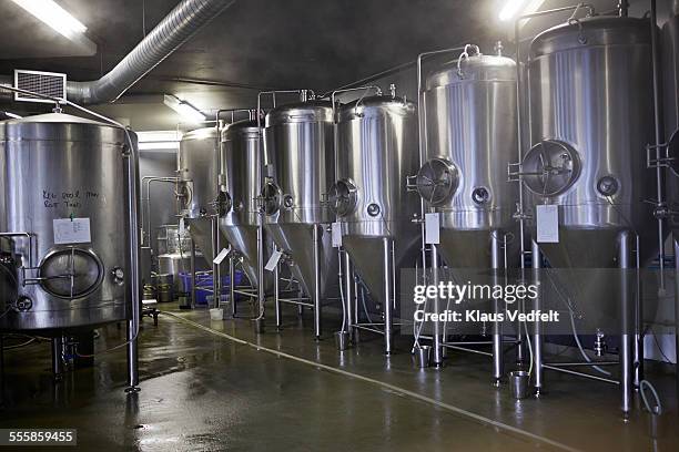 steel tanks at beer microbrewery - bier brouwen stockfoto's en -beelden