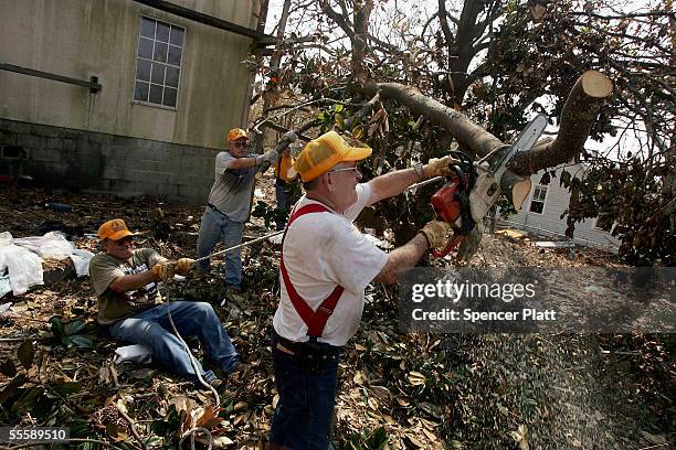 Floyd Smith, one of numerous volunteers with the Southern Baptist Convention based in Kansas and Nebraska, helps clear debris from a yard September...