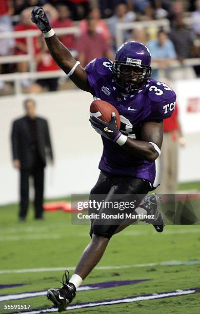 Tailback Robert Merrill of the Texas Christian University Horned Frogs runs for a touchdown against the Utah Utes on September 15, 2005 at Amon...