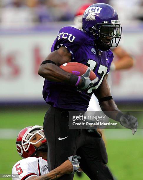 Wide receiver Cory Rodgers of the Texas Christian University Horned Frogs runs against defensive back Ryan Smith of the Utah Utes on September 15,...