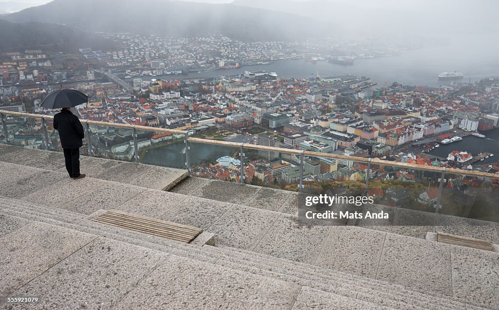 Man overlooking a rainy day in Bergen