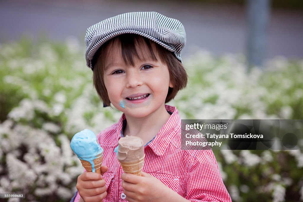 Beautiful cute Caucasian boy, eating ice cream