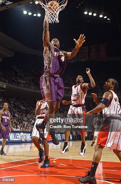 Forward Alton Ford of the Phoenix Suns shoots the ball during the NBA game against the Houston Rockets at the Compaq Center in Houston, Texas. The...