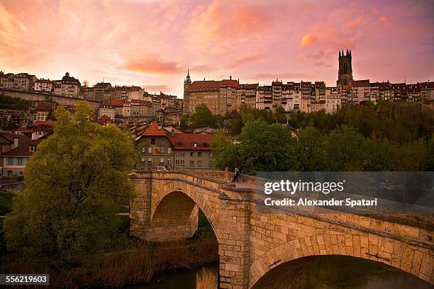dramatic sunset in fribourg, switzerland - freiburg skyline stock pictures, royalty-free photos & images
