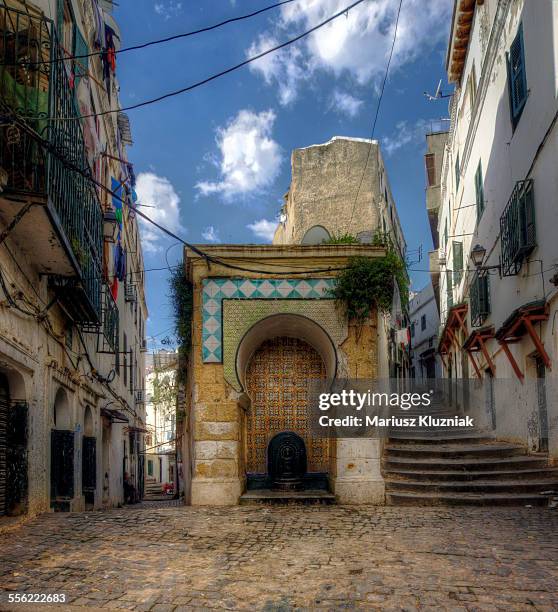 algiers kasbah old water fountain narrow streets - algiers algeria stockfoto's en -beelden