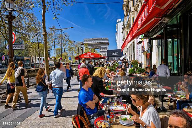 avenue des champs elysees in paris - france cafe stock pictures, royalty-free photos & images