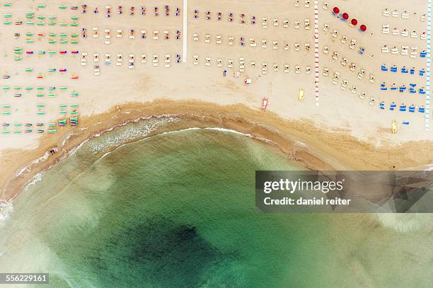 sunshades on a beach - rimini stock pictures, royalty-free photos & images