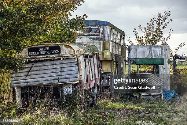 derelict buses - bus-out-of-service fotografías e imágenes de stock