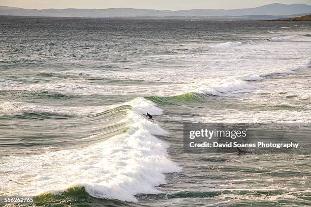 surfing in bundoran, county donegal, ireland - bundoran ireland stock pictures, royalty-free photos & images