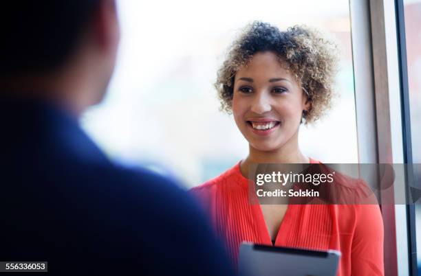 woman in meeting holding tablet - meeting silence stock pictures, royalty-free photos & images