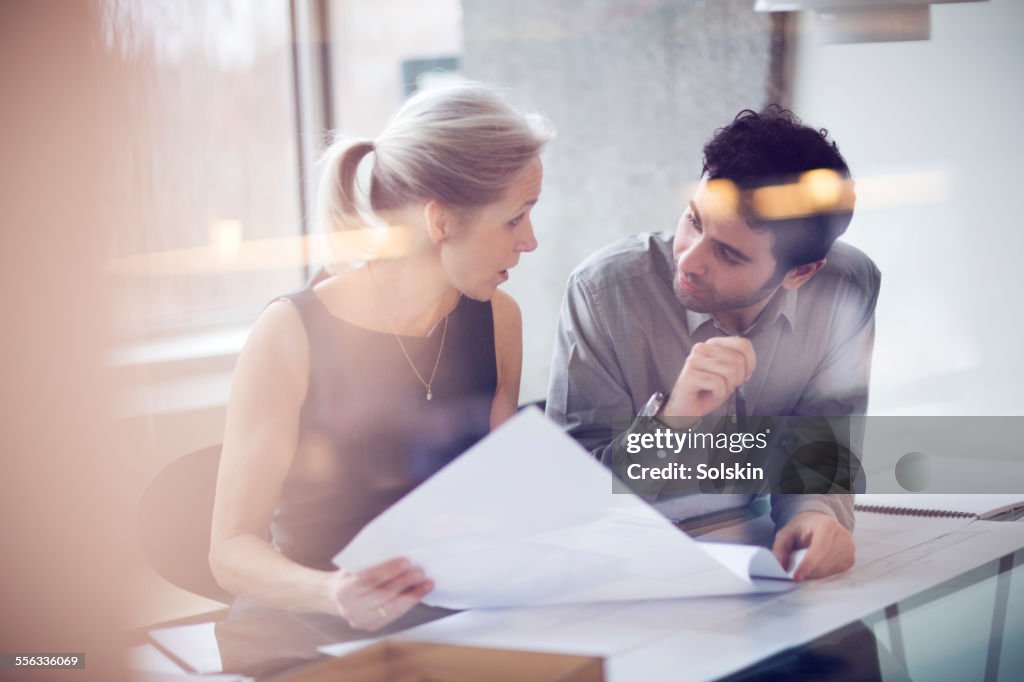 Man and woman in office having a meeting