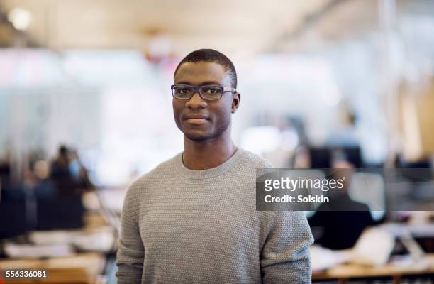 man in office looki - african ethnicity stock pictures, royalty-free photos & images