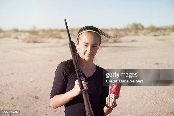 girl with bb gun and soda can - bb gun stock pictures, royalty-free photos & images