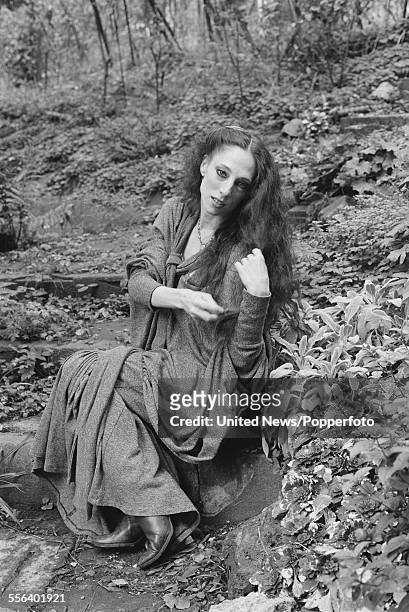 American born ballet dancer, Naomi Sorkin pictured sitting on steps in a woodland setting in England on 26th October 1983.