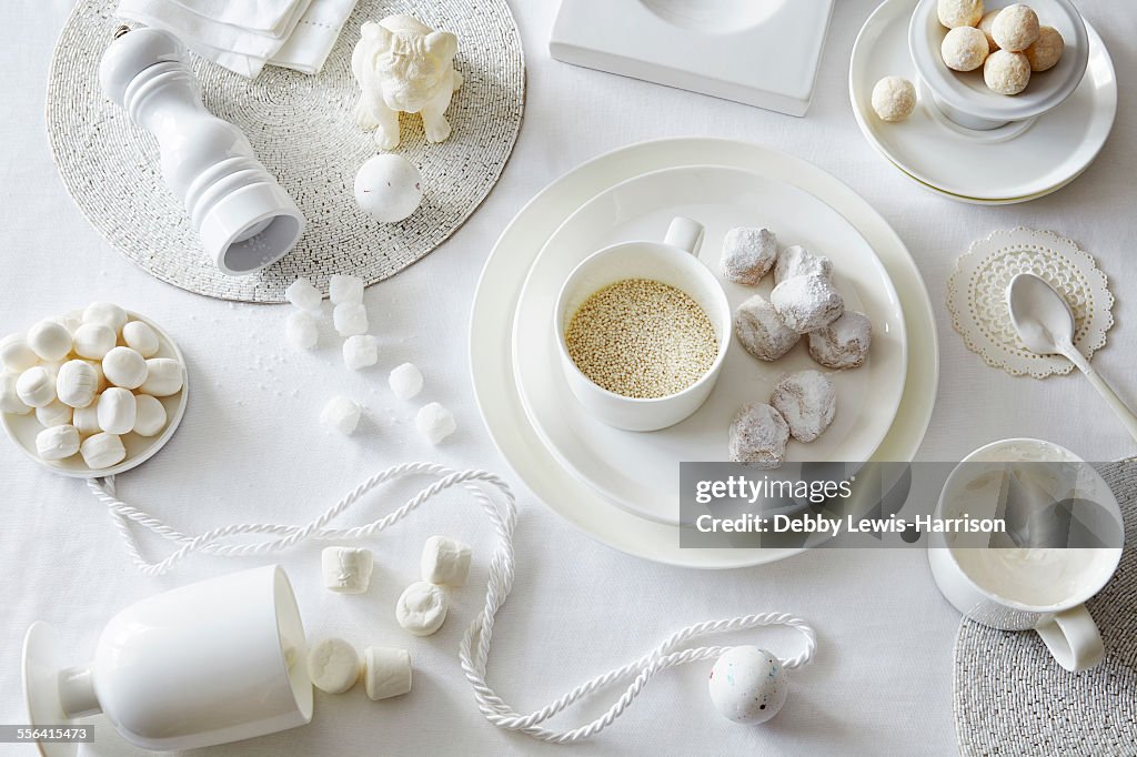 White colored still life with confectionery and sugar cubes