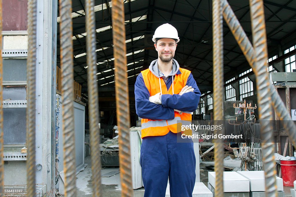 Portrait of factory worker outside concrete reinforcement factory