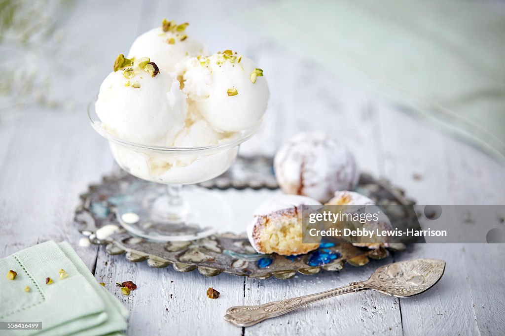 Still life of ice cream garnished with pistachio nuts