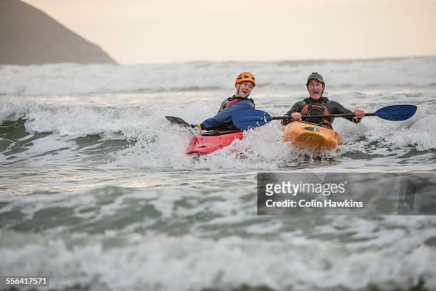 two men sea kayaking - sea kayaking imagens e fotografias de stock