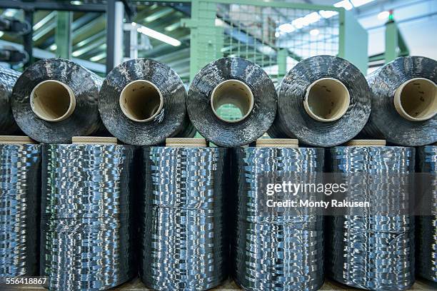 rows of carbon fibre in carbon fibre factory - carbon fibre stockfoto's en -beelden