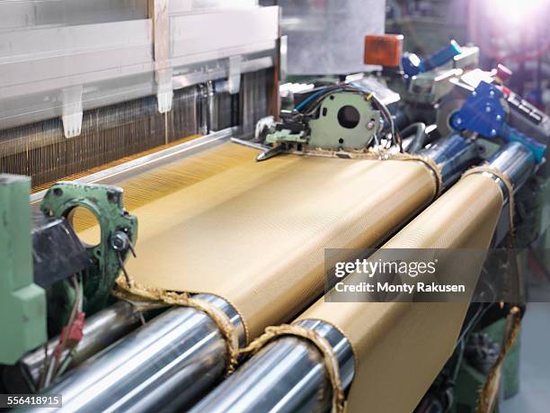 loom weaving kevlar fabric in carbon fibre factory - tear imagens e fotografias de stock