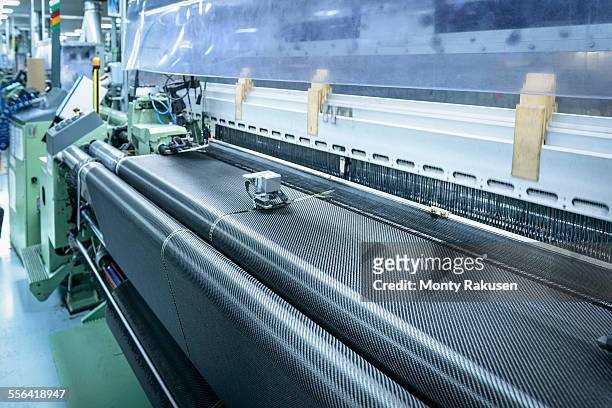 carbon fibre loom in detail in carbon fibre factory - tear imagens e fotografias de stock