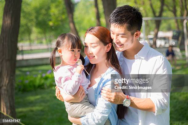family going for an outing - person holding flowers with high energy stock-fotos und bilder