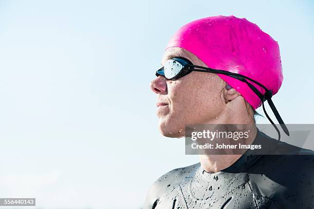 woman in wetsuit looking away - dykmask bildbanksfoton och bilder