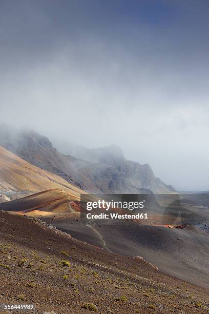 usa, hawaii, maui, haleakala, volcanic landscape with clouds and cinder cones - cinder cone volcano stock pictures, royalty-free photos & images